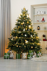 Canvas Print - Many gift boxes under Christmas tree decorated with ornaments and festive lights in room