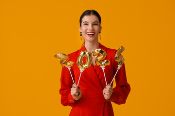 Poster - Beautiful young happy woman with figure 2024 made of balloons on yellow background. Chinese New Year celebration