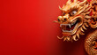 Chinese dragon for Chinese New Year. The dragon is a symbol of power, strength and good luck in Chinese culture. The dragon's mouth is open, as if it is roaring. Red copy space on the left
