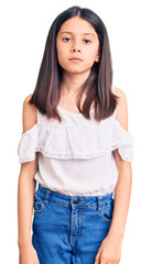 Canvas Print - Beautiful child girl wearing casual clothes relaxed with serious expression on face. simple and natural looking at the camera.