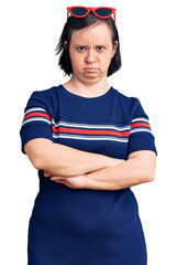 Sticker - Brunette woman with down syndrome wearing casual clothes skeptic and nervous, disapproving expression on face with crossed arms. negative person.