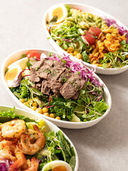 Poster - Fusilli salad, several different salads in bowls