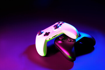 Gaming joystick on black background in neon light