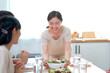 © DG PhotoStock - Happy Asian man and women enjoy having a launch together. Group of Asian people have a launch.