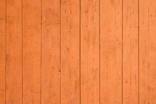 The Background Of The Wall With The Texture Of Boards Painted With Orange Paint
