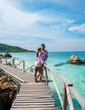 © Fokke Baarssen - A couple of men and woman at Ko Kham tropical Island Sattahip Chonburi Samaesan Thailand