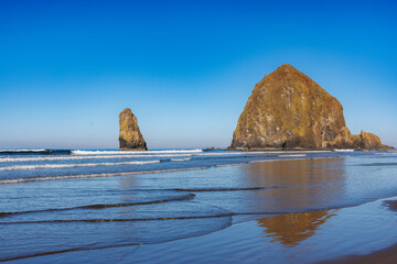 Waves washing ashore infront of Haystack Rock, Oregon