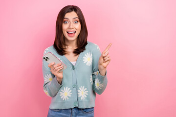 Poster - Photo of cute impressed woman dressed teal outfit showing empty space texting modern gadget isolated pink color background