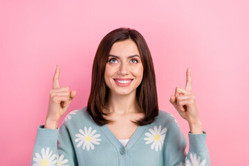 Wall Mural - Portrait of charming business lady look up direct fingers above head novelty poster wear cardigan isolated pink color background