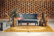 © Land of White Deer - christmass decor with a sofa inside a old house with brick wall