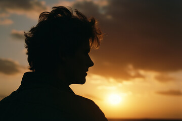 Poster - A silhouette of a person deep in thought, gazing into the sunset, evoking contemplation and philosophical reflection.