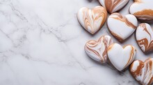 Heart Shaped Caramel Cookies Decorated On Simple Marble Top