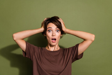 Sticker - Photo portrait of lovely young lady touch head astonished frightened dressed stylish brown garment isolated on khaki color background