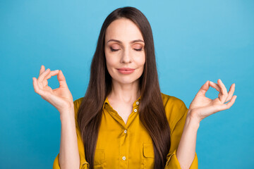 Poster - Photo of dreamy good mood woman dressed yellow shirt closed eyes practicing yoga isolated blue color background