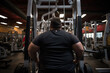 © Layerform - overweight obese plus sized man in the gym working hard trying to lose weight