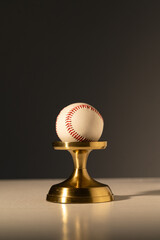 Poster - a baseball on a stand. Baseball equipment.