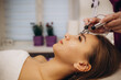 © Roman - Woman getting microcurrent procedure facelift. Beautician doing anti-aging, to perform facial tightening and toning.