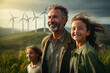 Father and daughters standing in nature with windmills. Alternative energy and sustainable energy
