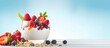 Front view of a healthy breakfast with vegetarian yogurt granola and fresh fruit on a blue table in a white kitchen Copy space image Place for adding text or design