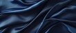 Luxurious blue silk satin backdrop with space for text design Web banner Top view table for special occasions Copy space image Place for adding text or design