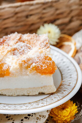 Canvas Print - Cheesecake with apricot marmalade and coconut flakes. Recipe for a delicious homemade cake.