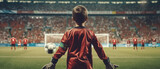 Fototapeta Sport - 9 year old goalkeeper standing in the stadium