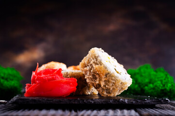 Sticker - Sushi roll with salmon, smoked eel, avocado, cream cheese on black background. Sushi menu. Japanese food.