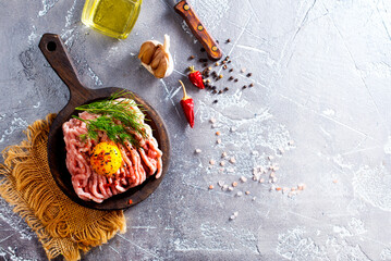 Wall Mural - Raw minced meat with olive oil, yolk, and garlic.