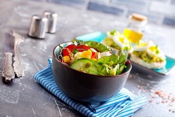 Wall Mural - Green vegan salad from green leaves mix and vegetables. diet food