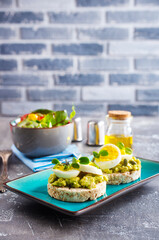 Wall Mural - Healthy tasty toast with avocado, white cheese and boiled egg on plate