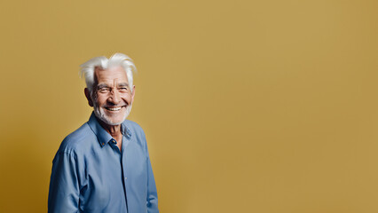 Wall Mural - Old man smiling isolated on studio background. Copyspace area