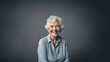 © Mangata Imagine - Beautiful old woman smiling isolated on studio background. Copyspace area