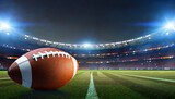 Fototapeta Sport - American football players on the field with closeup on ball and stadium lights. Sports background