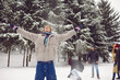 © Studio Romantic - Happy diverse young people in outerwear play snowballs enjoy winter vacation in snowy park. Smiling friends have fun relax in frosty forest on active weekend outdoors. Activity and holidays.