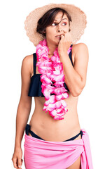 Poster - Beautiful young woman with short hair wearing bikini and hawaiian lei looking stressed and nervous with hands on mouth biting nails. anxiety problem.