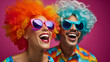 Young positive woman and man in wigs celebrating birthday party, bright makeup pink hair sunglasses, pink wig, glamor stylish glasses color background, April Fools' Day, copy space