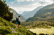 © Anna Peipina - Hiking man on a hiking path in Switzerland Alps overlooks the horizon