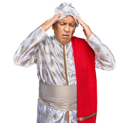 Poster - Senior hispanic man wearing tradition sherwani saree clothes with hand on head for pain in head because stress. suffering migraine.