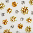 © Alena - Golden and silver decorative gift bows on a white background