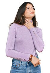 Sticker - Young beautiful teen girl wearing turtleneck sweater touching painful neck, sore throat for flu, clod and infection