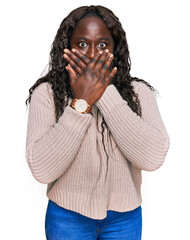 Sticker - Young african woman wearing wool winter sweater shocked covering mouth with hands for mistake. secret concept.