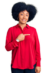 Canvas Print - Young african american girl wearing casual clothes pointing aside worried and nervous with forefinger, concerned and surprised expression