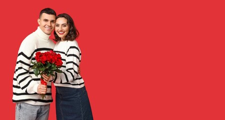 Canvas Print - Happy young couple with bouquet of beautiful roses on red background with space for text. Valentine's Day celebration