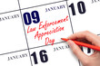 January 9. Hand writing text Law Enforcement Appreciation Day on calendar date. Save the date.