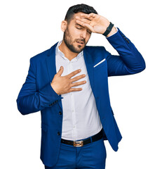 Poster - Young hispanic man wearing business jacket touching forehead for illness and fever, flu and cold, virus sick