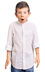 Poster - Cute blond kid wearing elegant shirt afraid and shocked with surprise and amazed expression, fear and excited face.