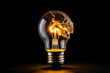 © mila103 - Burning incandescent light bulb on black background, energy concept