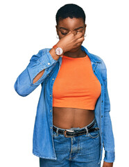 Canvas Print - Young african american woman wearing casual clothes tired rubbing nose and eyes feeling fatigue and headache. stress and frustration concept.