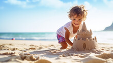 Boy At Sunset Builds A Sand Castle On The Shore