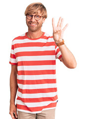 Canvas Print - Handsome caucasian man with beard wearing casual clothes and glasses showing and pointing up with fingers number four while smiling confident and happy.